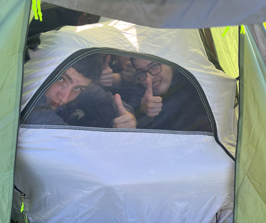 students in a tent.