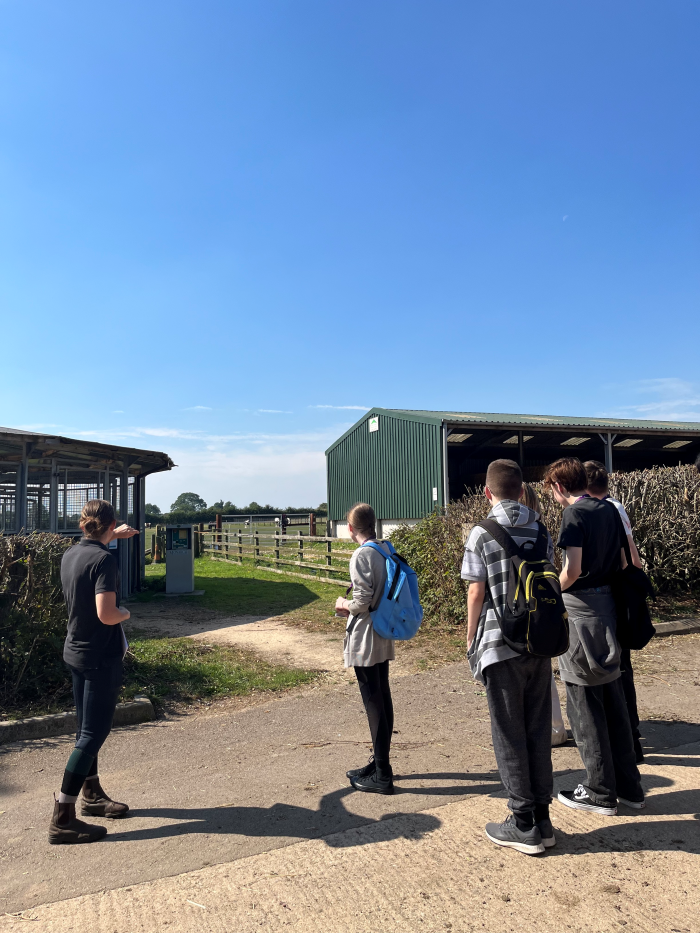 A teacher showing Students about the college.