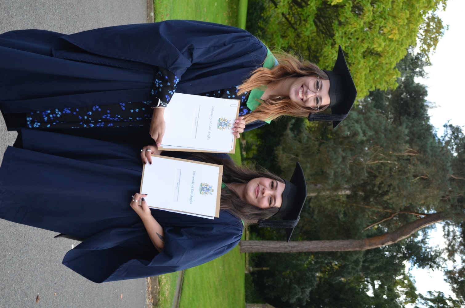 2 female students graduate picture.