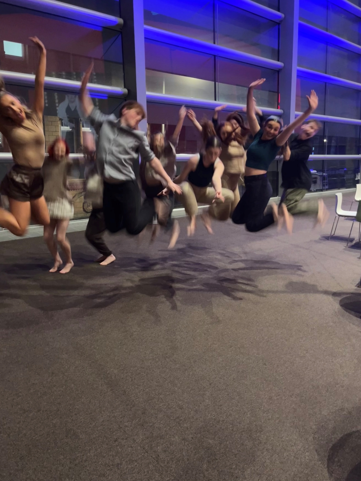 IGNITE Performing Arts Students group jumping.